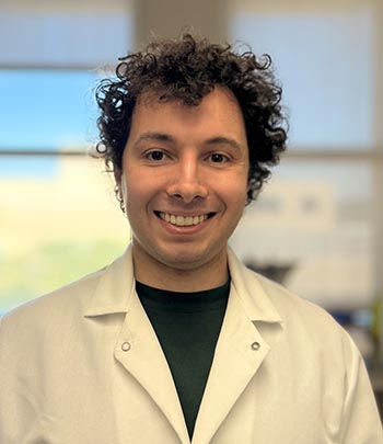 John Soukar posing in a research laboratory