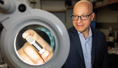 Jonathan Rivnay holding a biohybrid device