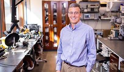 John Rogers posing in his research laboratory