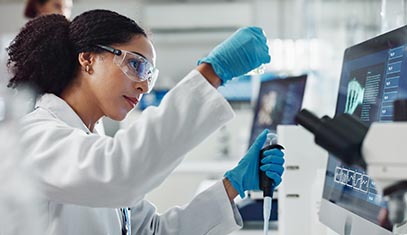 A scientist looking at materials in a laboratory setting